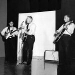 1961-Bob-Melrose and his band playing guitars on stage